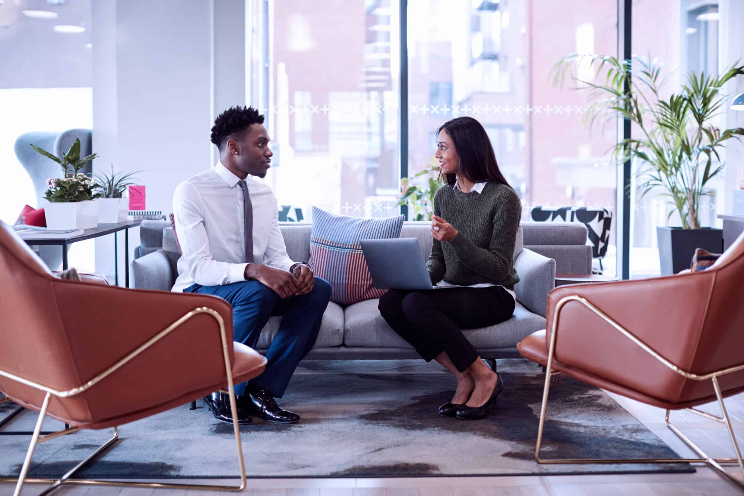 Two people sitting down in an interview situation.