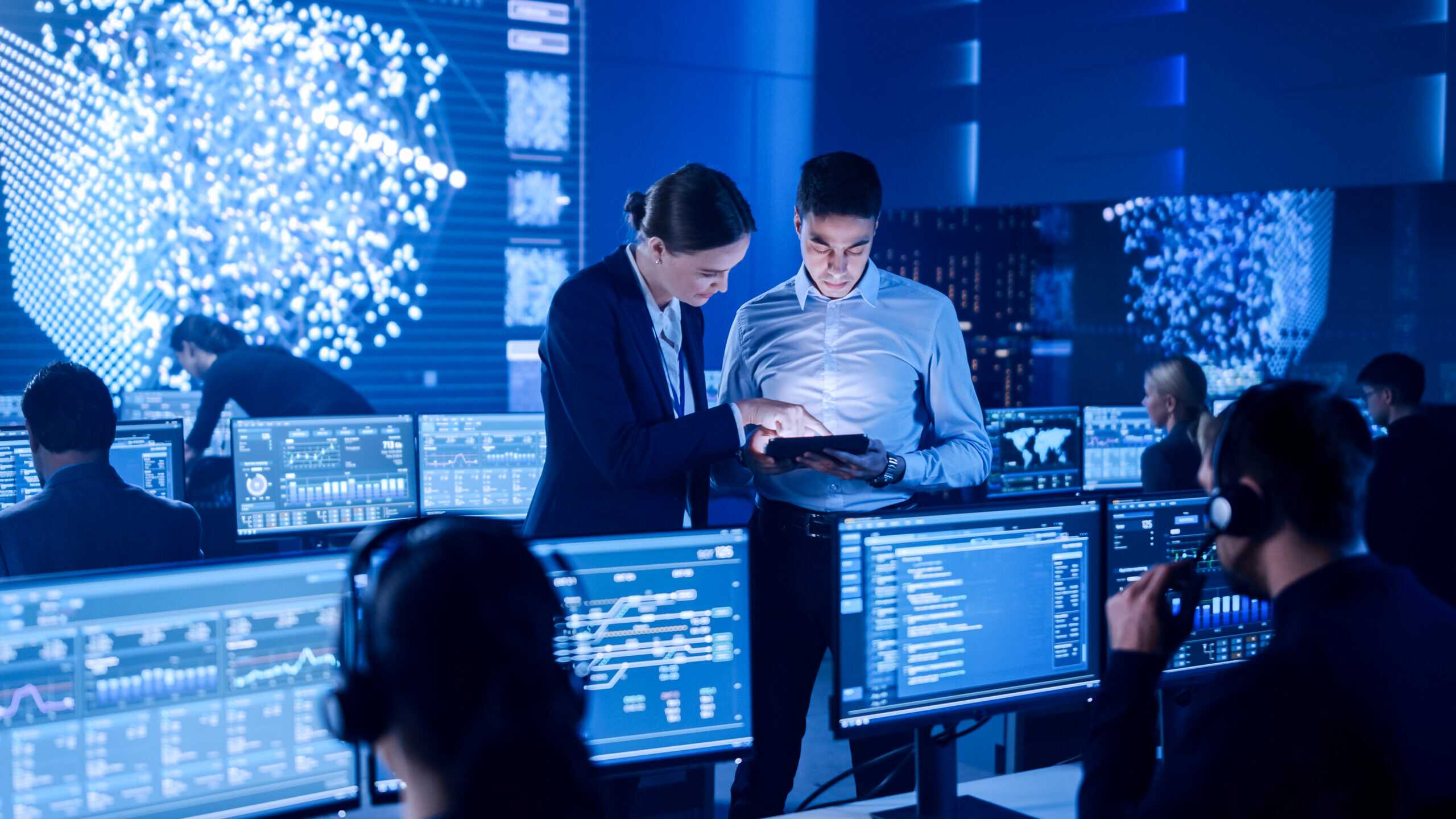Project Manager And Computer Science Engineer Talking While Usin