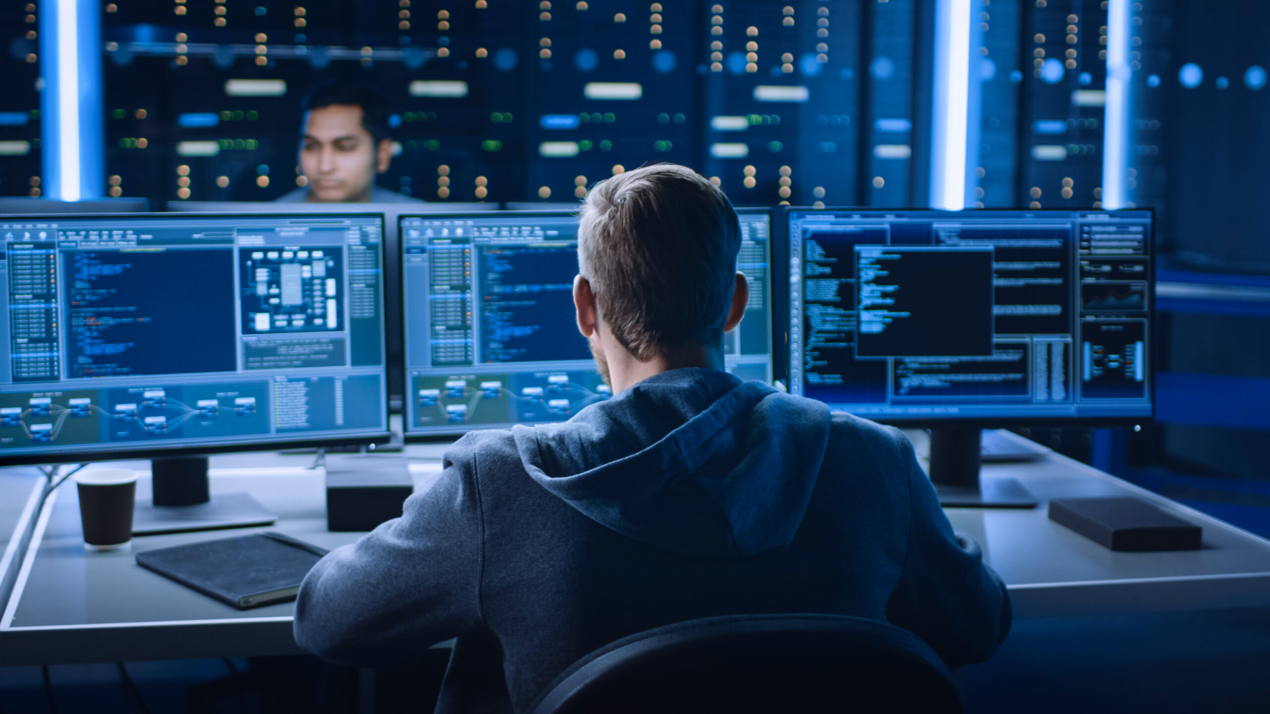 It Specialist Works On Personal Computer With Screens Showing So