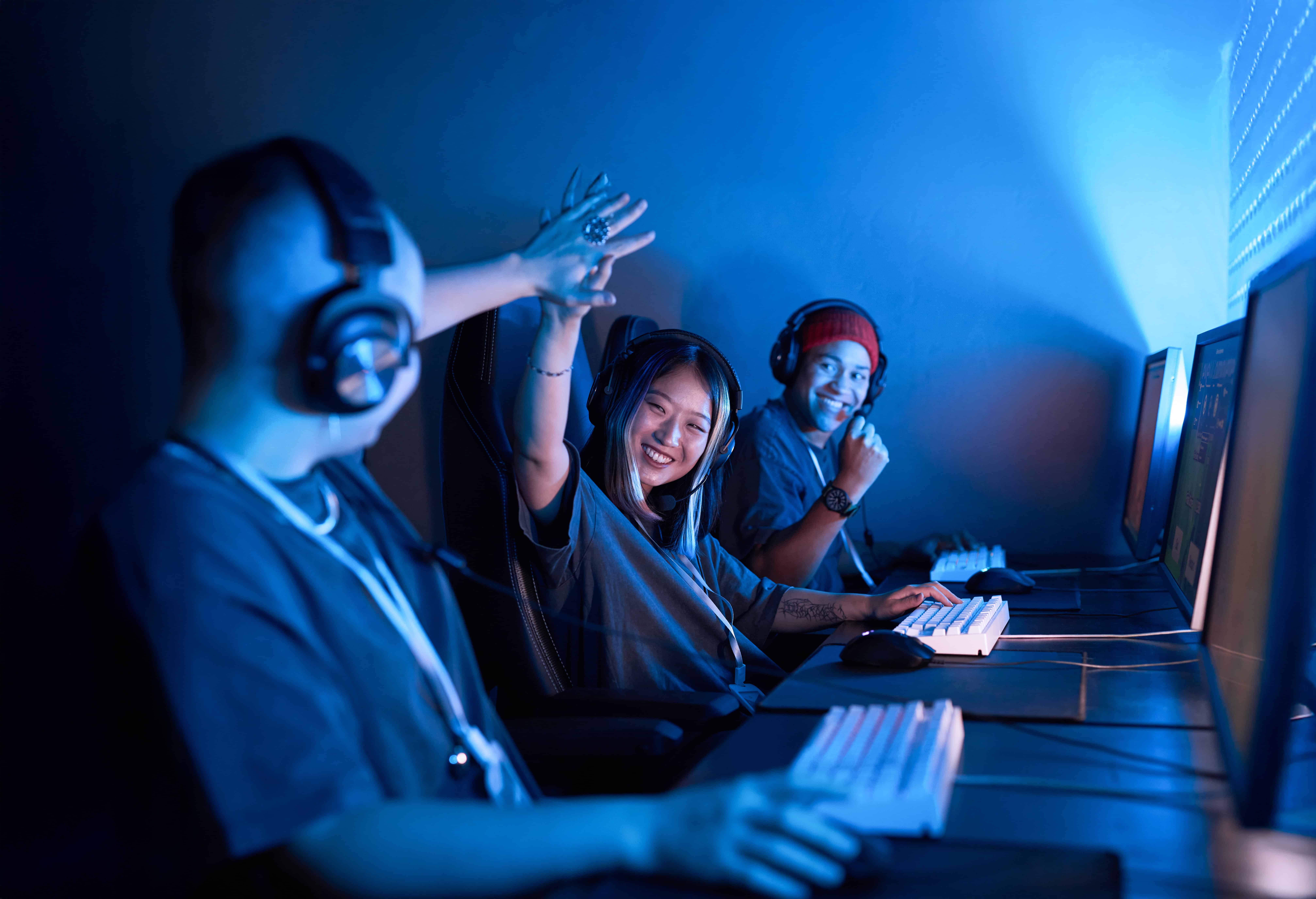 Asian Female Gamer High Five Teammate