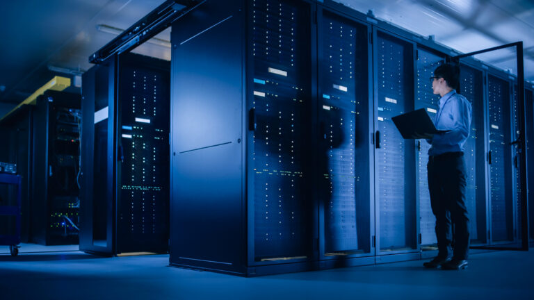 In Data Center: Male It Technician Running Maintenance Programme
